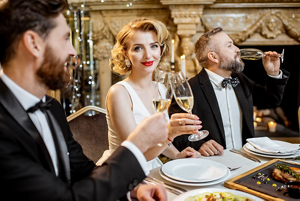Beautiful blonde woman at a black tie event with friends